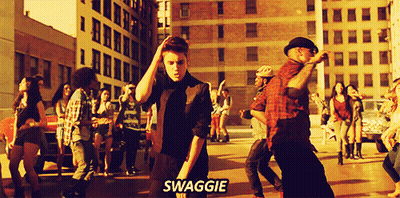 A Group Of People Are Dancing On The Street And The Word Swagge Is On The Bottom GIF
