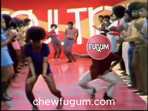 A Group Of People Are Dancing With A Fugum Balloon In The Middle GIF
