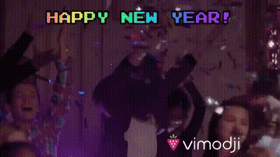 A Group Of People Are Dancing With The Words Happy New Year Written In The Background GIF