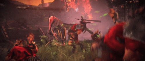A Group Of People Are Fighting A Monster In A Field GIF