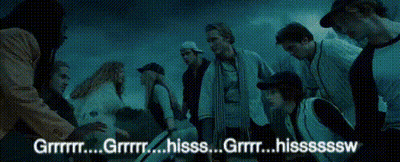 A Group Of People Are Gathered In A Dark Room With The Words " Grrr " Written On The Bottom GIF