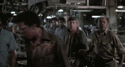 A Group Of People Are Gathered In A Room And The Words Blue Collar Are Visible GIF
