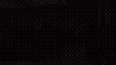 A Group Of People Are Gathered In A Room With Hulk Posters On The Floor GIF