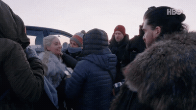A Group Of People Are Gathered In Front Of A Car With Hbo On The Bottom Left GIF