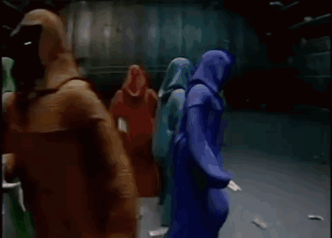 A Group Of People Are Holding Signs That Say Shadow Wizard And Money Gang . GIF