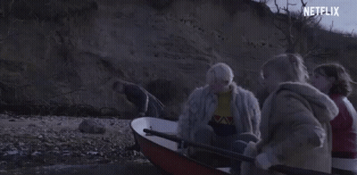 A Group Of People Are In A Boat With A Netflix Logo In The Corner . GIF