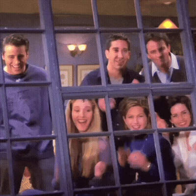 A Group Of People Are Looking Out Of A Window GIF