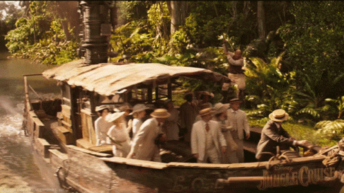 A Group Of People Are On A Boat Called The Jungle Cruise GIF