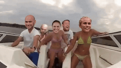 A Group Of People Are On A Boat With Their Faces On The Side . GIF