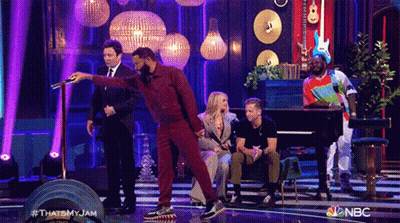A Group Of People Are On A Stage With A Nbc Logo On The Bottom GIF