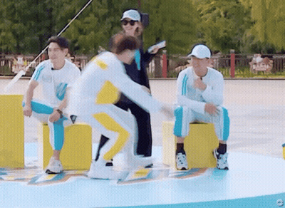 A Group Of People Are Playing A Game And One Of Them Is Jumping GIF