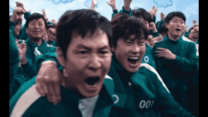 A Group Of People Are Playing A Game Called Squid Game And One Of The Players Has The Number 001 On His Shirt . GIF