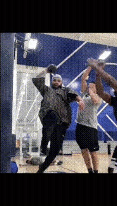 A Group Of People Are Playing A Game Of Basketball GIF