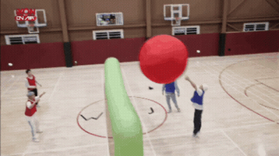 A Group Of People Are Playing A Game Of Dodgeball On A Basketball Court Sponsored By Mon On Air GIF