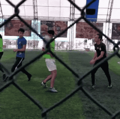 A Group Of People Are Playing A Game Of Soccer GIF