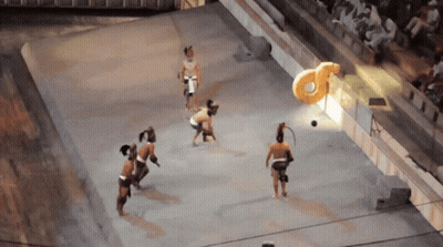 A Group Of People Are Playing A Game Of Soccer In Front Of A Large Letter A GIF
