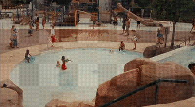 A Group Of People Are Playing In A Pool With The Word Turbo On The Ground GIF