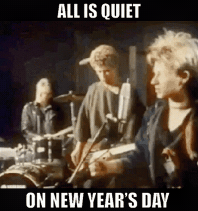A Group Of People Are Playing Instruments On A Stage And They Are All Quiet On New Year 'S Day . GIF