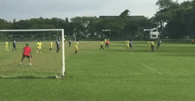 A Group Of People Are Playing Soccer In A Field GIF