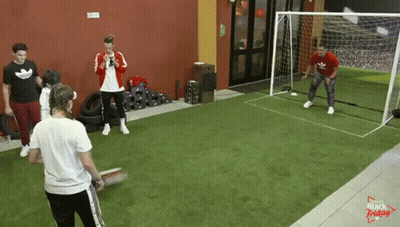 A Group Of People Are Playing Soccer In A Room That Says Black Friday On It GIF