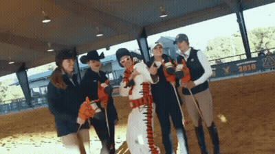 A Group Of People Are Posing For A Picture In Front Of A Banner That Says 2018 GIF
