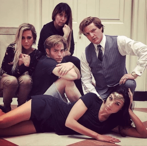 A Group Of People Are Posing For A Picture Including A Woman Wearing A Wonder Woman Headband GIF