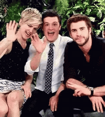 A Group Of People Are Posing For A Picture Together . GIF