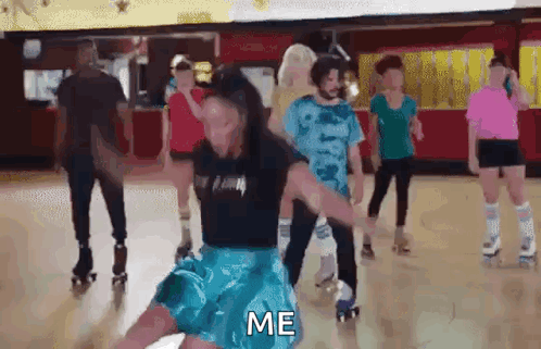 A Group Of People Are Rollerblading In A Roller Rink And One Of Them Is Holding Another Person 'S Arm . GIF