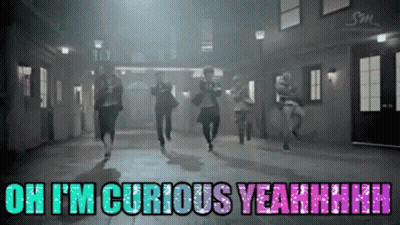 A Group Of People Are Running Down A Street With The Words Oh I 'M Curious Yeahhhh On The Bottom GIF