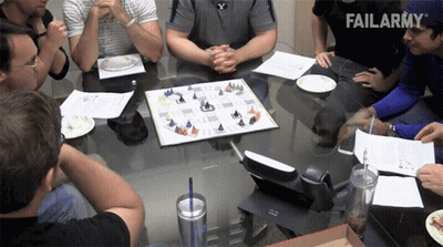 A Group Of People Are Sitting Around A Table With A Failarmy Logo In The Background GIF