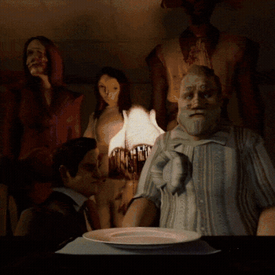 A Group Of People Are Sitting Around A Table With A Plate Of Food GIF