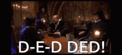 A Group Of People Are Sitting Around A Table With The Words D-E-D Ded GIF