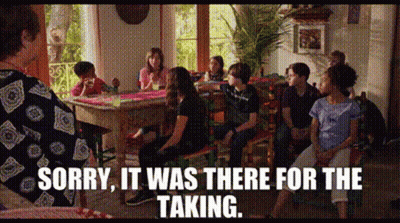 A Group Of People Are Sitting Around A Table With The Words Sorry It Was There For The Taking On The Bottom GIF