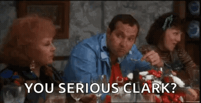A Group Of People Are Sitting At A Table Eating Food And A Man Is Asking A Question . GIF