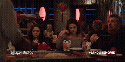 A Group Of People Are Sitting At A Table In A Restaurant With Amazonstudios Written On The Bottom Right GIF