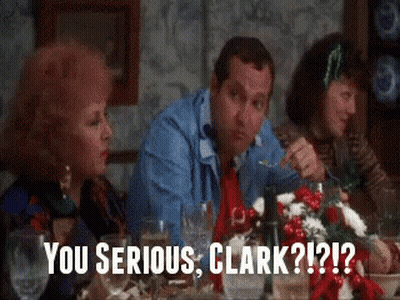 A Group Of People Are Sitting At A Table With A Caption That Says You Serious Clark ?? GIF