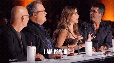 A Group Of People Are Sitting At A Table With Microphones And One Of Them Says I Am Psychic GIF