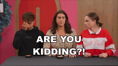 A Group Of People Are Sitting At A Table With The Words " Are You Kidding " Written On The Screen GIF
