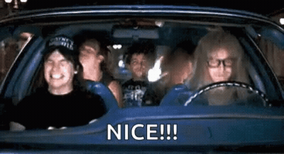 A Group Of People Are Sitting In A Car With The Words `` Nice ! '' Written On The Side . GIF