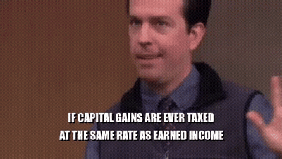 A Group Of People Are Sitting In A Room With A Man In A Purple Shirt And Tie Sitting In Front Of Them . GIF