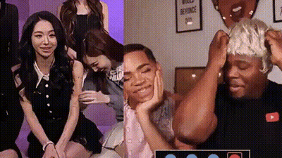 A Group Of People Are Sitting In A Room With A Sign That Says World Beyonce Day . GIF