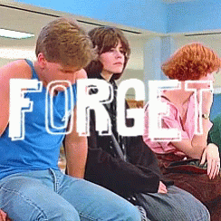 A Group Of People Are Sitting In A Room With The Word Forget Written In White Letters GIF