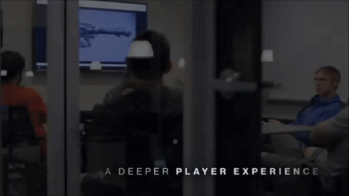 A Group Of People Are Sitting In A Room With The Words A Deeper Player Experience GIF