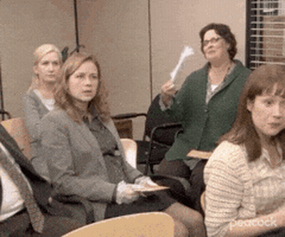 A Group Of People Are Sitting In Chairs In A Room With Peacock Written On The Bottom GIF