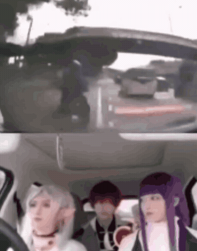 A Group Of People Are Sitting In The Back Seat Of A Car Looking Out The Window . GIF