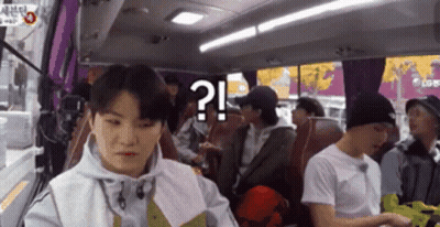 A Group Of People Are Sitting On A Bus And One Of Them Has A Question Mark On Their Face GIF