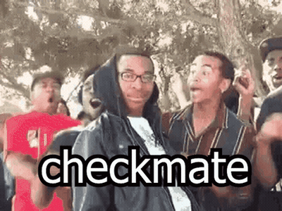 A Group Of People Are Standing Around A Man In A Hooded Jacket . GIF