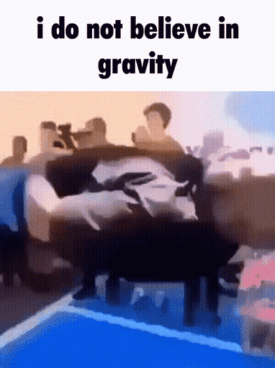 A Group Of People Are Standing Around A Pool With The Caption I Do Not Believe In Gravity GIF