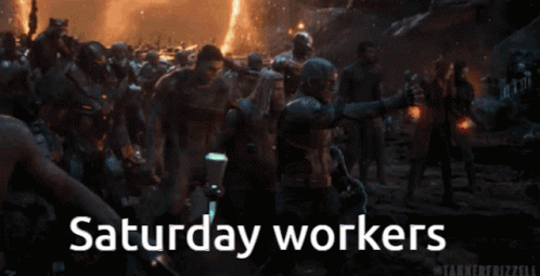 A Group Of People Are Standing In A Crowd And The Words Saturday Workers Are Visible GIF