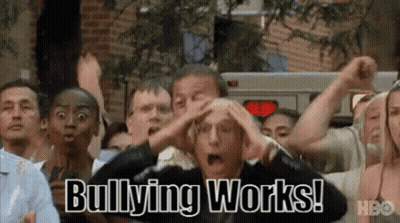 A Group Of People Are Standing In A Crowd With Their Hands On Their Heads And Bullying Works Written On The Screen . GIF